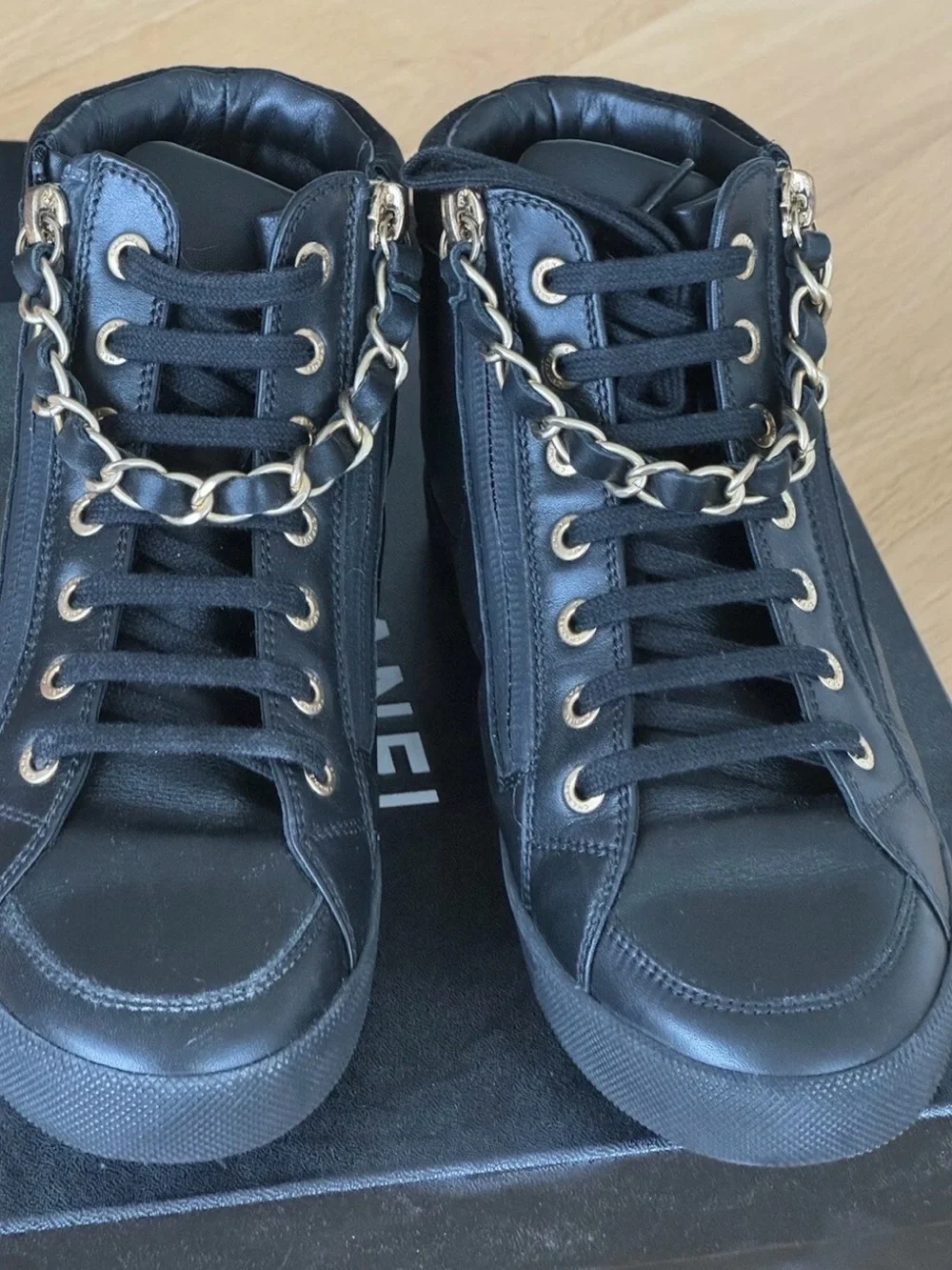 CHANEL Black Quilted High-Top Leather Sneakers with Gold Hardware